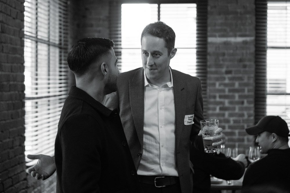 Joe Salazar speaking with an individual at the top 25 Innovators in Construction Award night